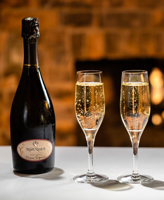 Two champaign flutes of sparkeling wine placed on a table at Pechanga Resort Casino's Great Oak Steakhouse Restaurant in Temecula, CA